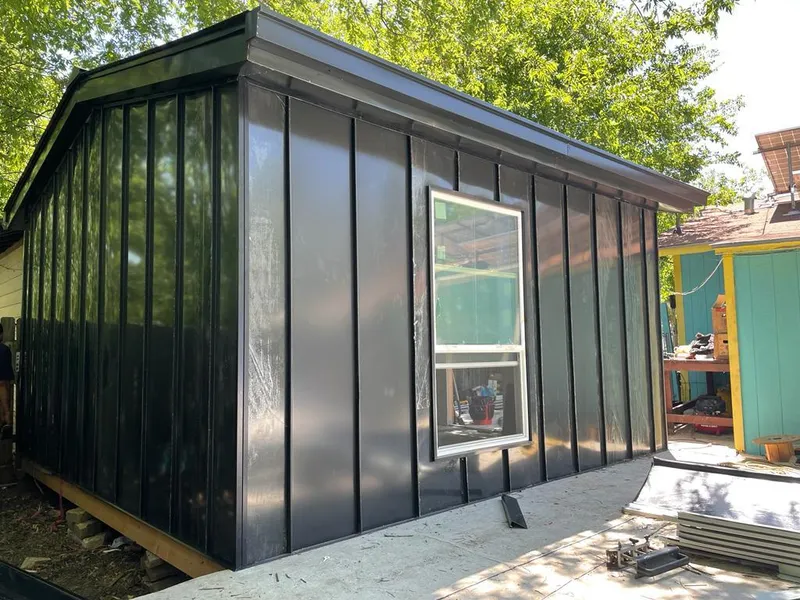 Black standing seam metal wall panels for Roof Inspection in Richardson