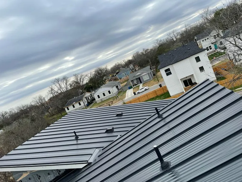Standing seam metal roof panels with vents for Skylight Repair in Richardson